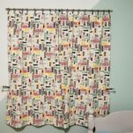 NYC homemade no sew curtains closed hanging in a window.